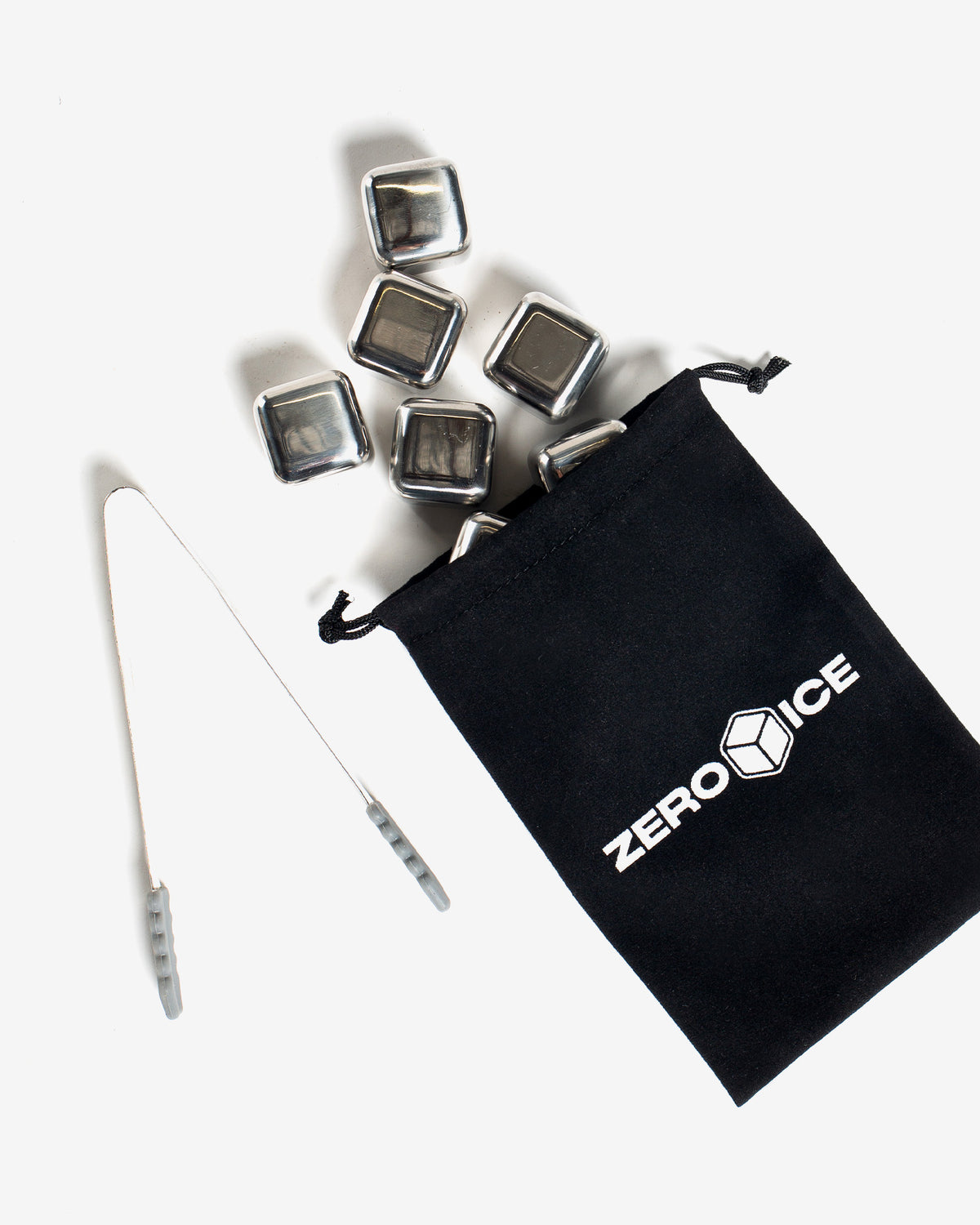Set of metal ice cube trays with a black drawstring bag labeled 'Zero Ice' on a white background.